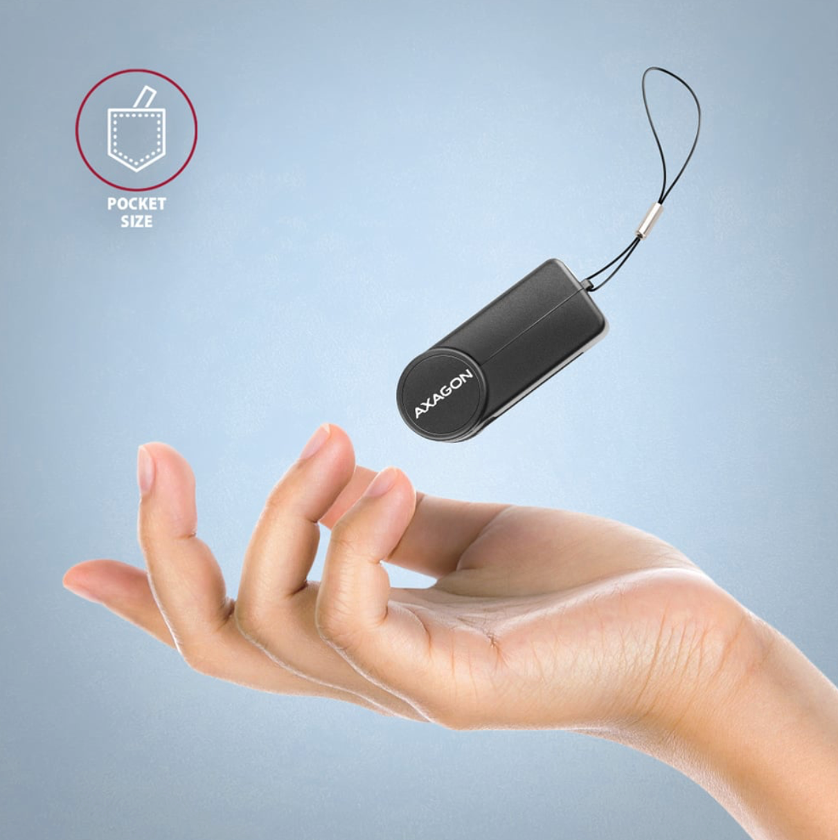 Small black device labeled 'Avagon' held in a hand with a light blue background